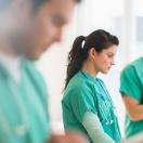 Nurses working with tablets and laptops