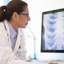 Doctor looking at an X-ray on a computer screen