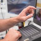 Healthcare worker using touchscreen computer terminal