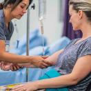 Nurse prepping a patient for IV insertion