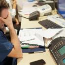 Stressed healthcare worker at a desk