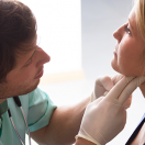 Doctor examining patient.