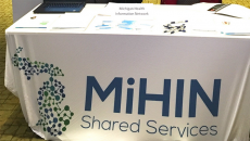 Michigan Health Information Network Shared Services display booth at an event.