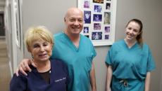 Three smiling medical professionals