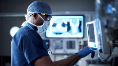 Surgeons looking at display