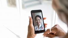 Person attending telehealth appointment on smartphone