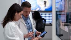 Healthcare workers looking at tablet