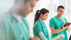 Nurses working with tablets and laptops