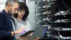 IT and security professionals in a server room