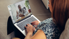 Doctor and patient have telehealth consult on laptop computer