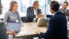 Business people shaking hands at a meeting