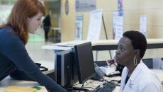 A patient inquiring with a nurse