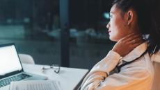 Healthcare worker looking at laptop screen