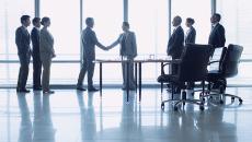 Business people greeting in a lobby