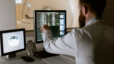 Radiologist looks at an MRI on screen