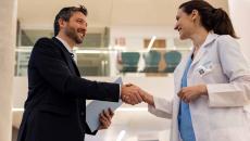 Doctor shaking hands with executive