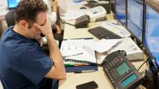 Stressed healthcare worker at a desk