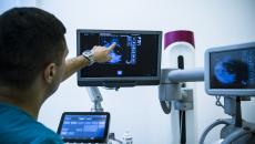 Radiologist examines imaging scan