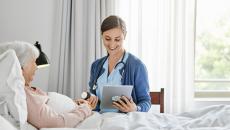 Nurse reviews discharge instructions with patient