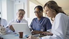 doctors looking at a computer