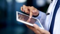 Clinician hands holding tablet