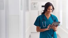 Healthcare worker using tablet