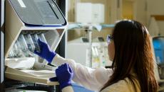 Medical professional holding a test tube.