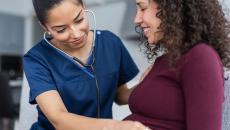 Healthcare provider helping a patient