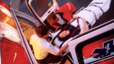 A patient on a stretcher being transported into an ambulance