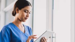 Healthcare worker using tablet