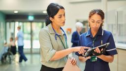 Hospital colleagues share article on tablet