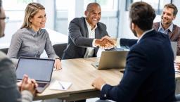 Business people shaking hands at a meeting