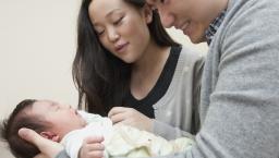 Couple holding baby