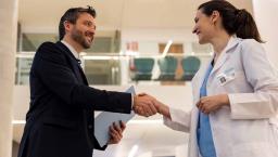 Doctor shaking hands with executive