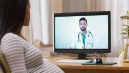 Pregnant person talking to doctor on screen