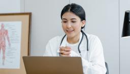 Female doctor at laptop 