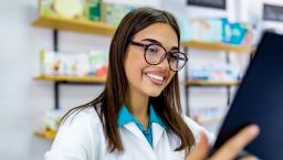 A pharmacist reviewing a digital record