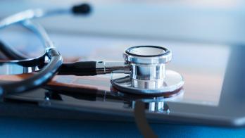 Stethoscope resting on tablet