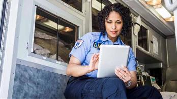 Paramedic using tablet