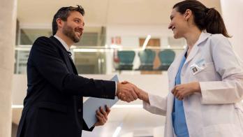 Doctor shaking hands with executive