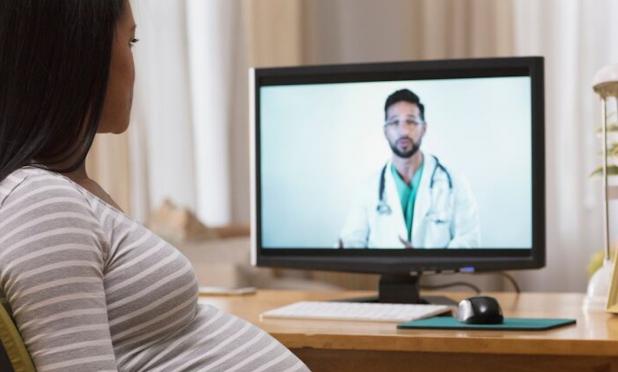 Pregnant person talking to doctor on screen