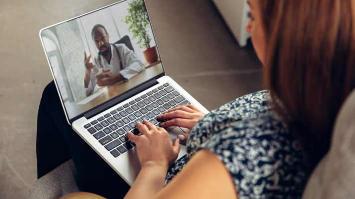 A telehealth visit via laptop