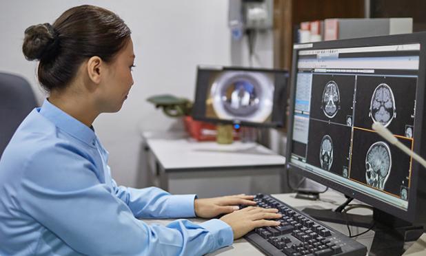 Radiologist looking at medical images on a computer