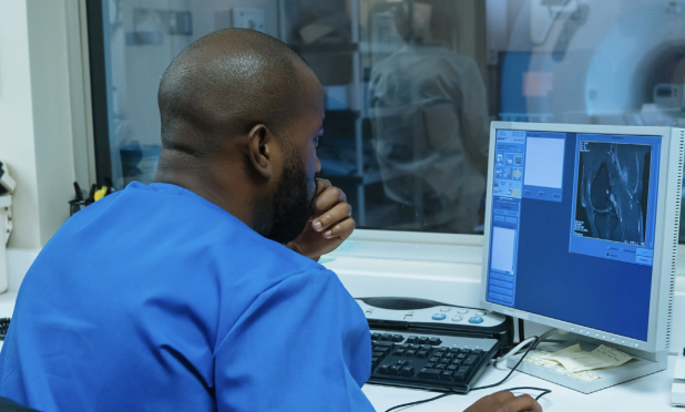 Radiologist looking at a medical image on a computer.